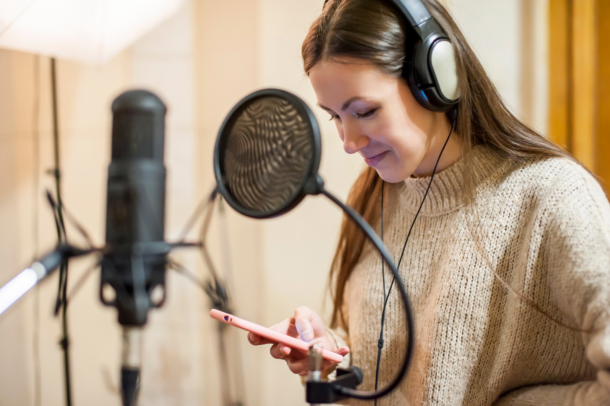 young-girl-singer-recording-vocals-in-professional-recording-studio-close-up.jpg