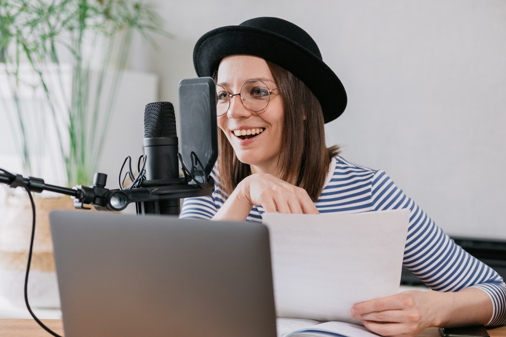 woman-with-microphone-and-headphones-in-recording-studio-recording-content-or-podcast.jpg